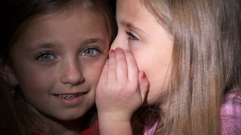 Girl Whispering to Other Girl