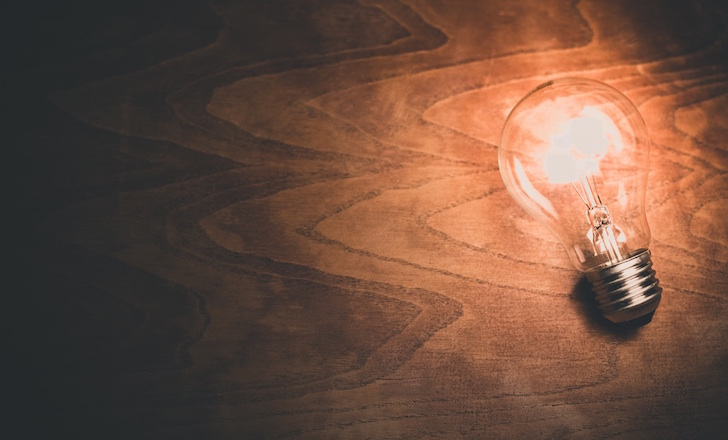 Lightbulb on wood table